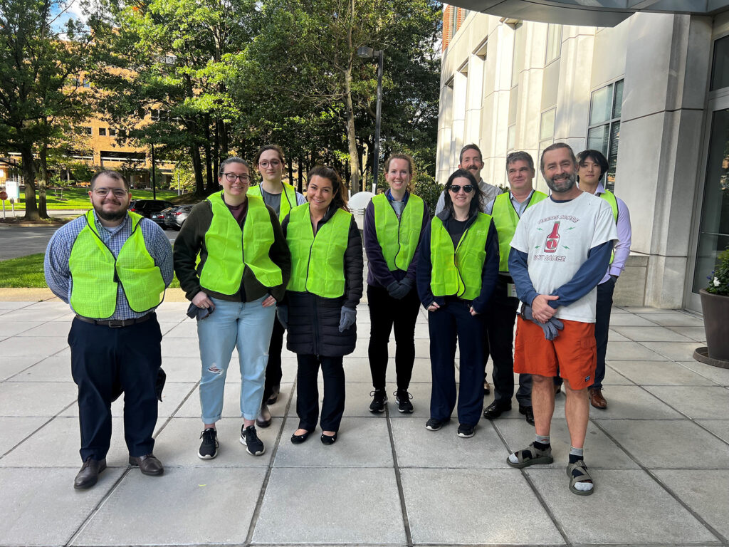 A group of SPA employees pose after cleaning up the highway together in the community